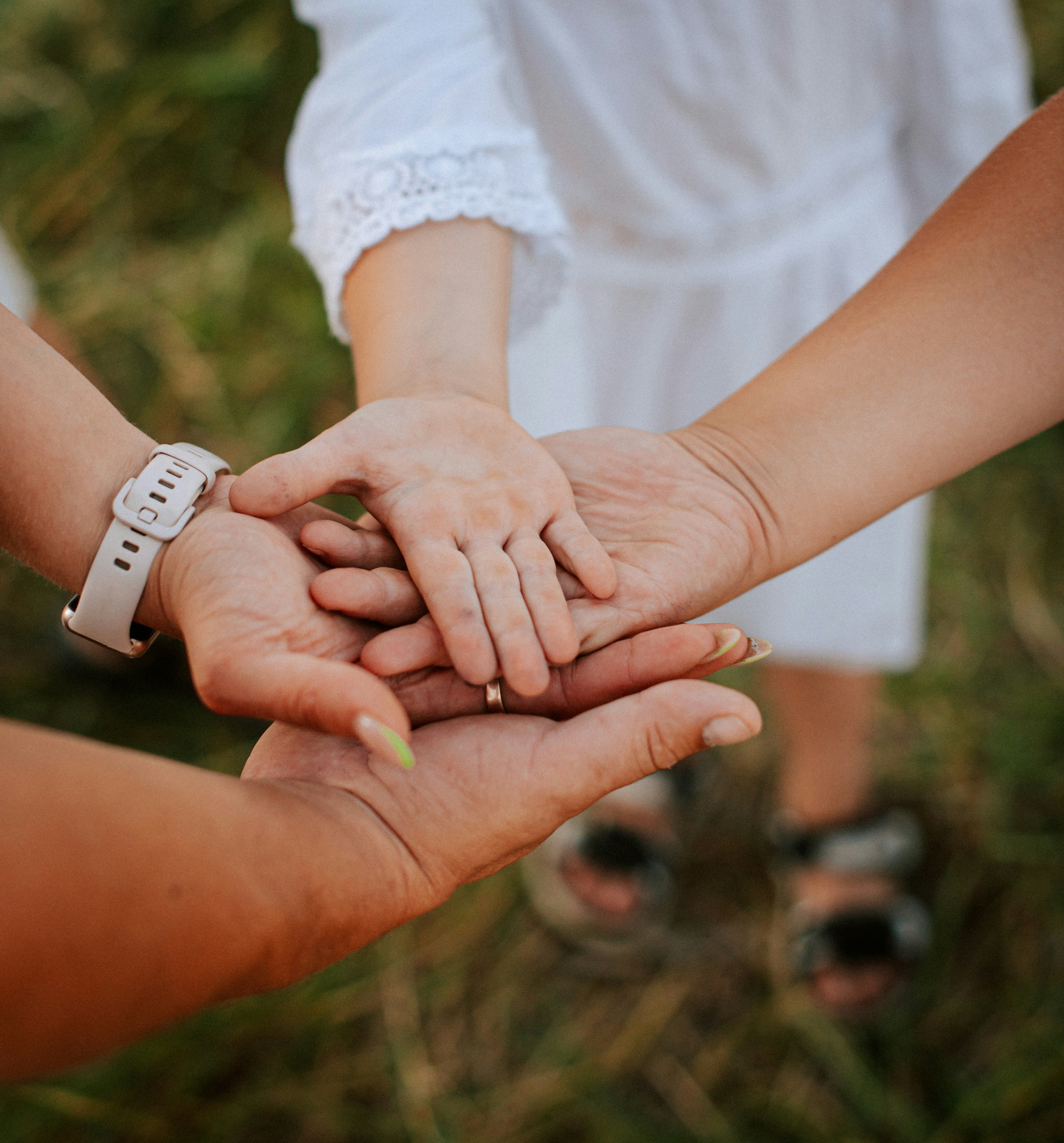 A close up of two people holding hands