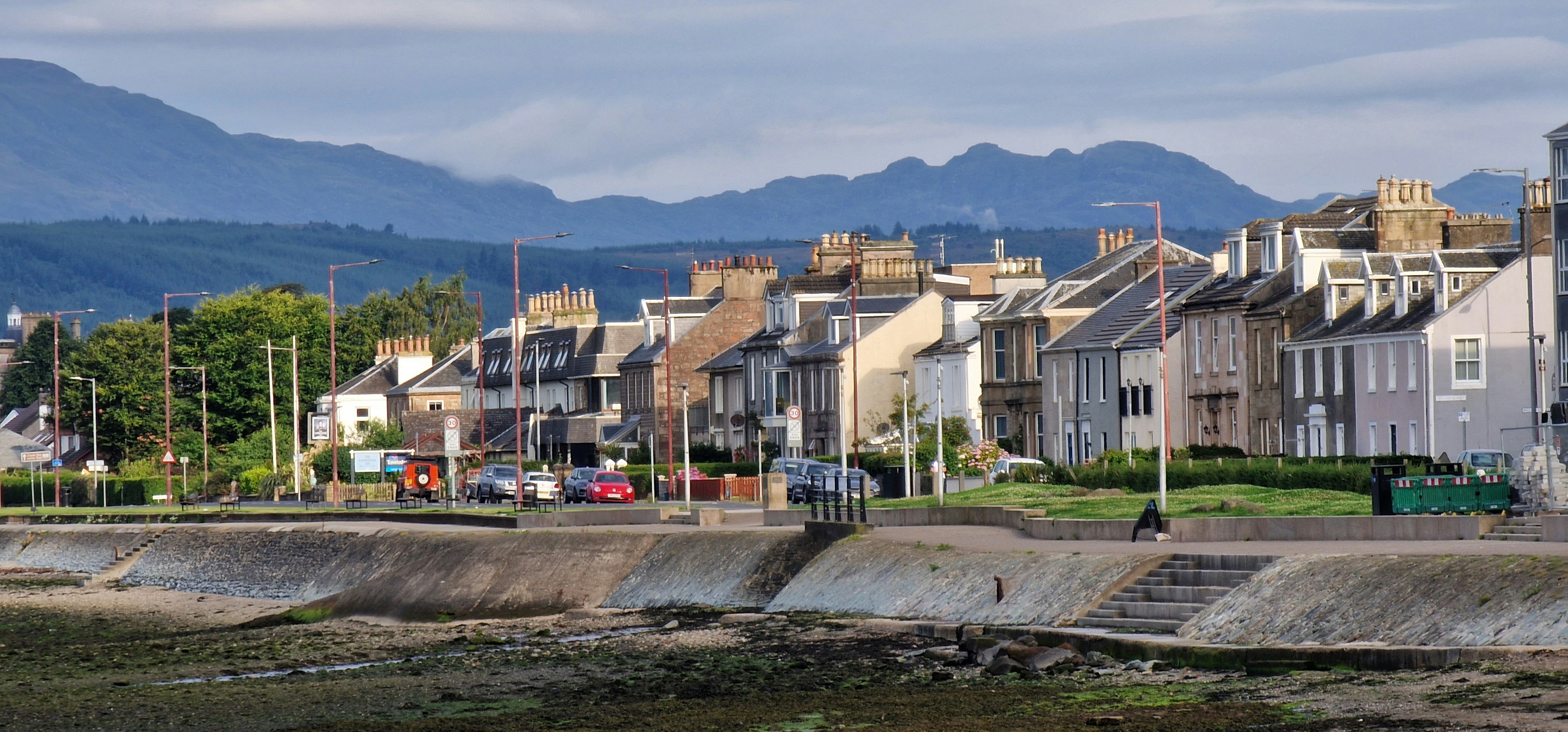 A row of houses next to a body of water (Photo by Stuart Ramsay on Unsplash)
