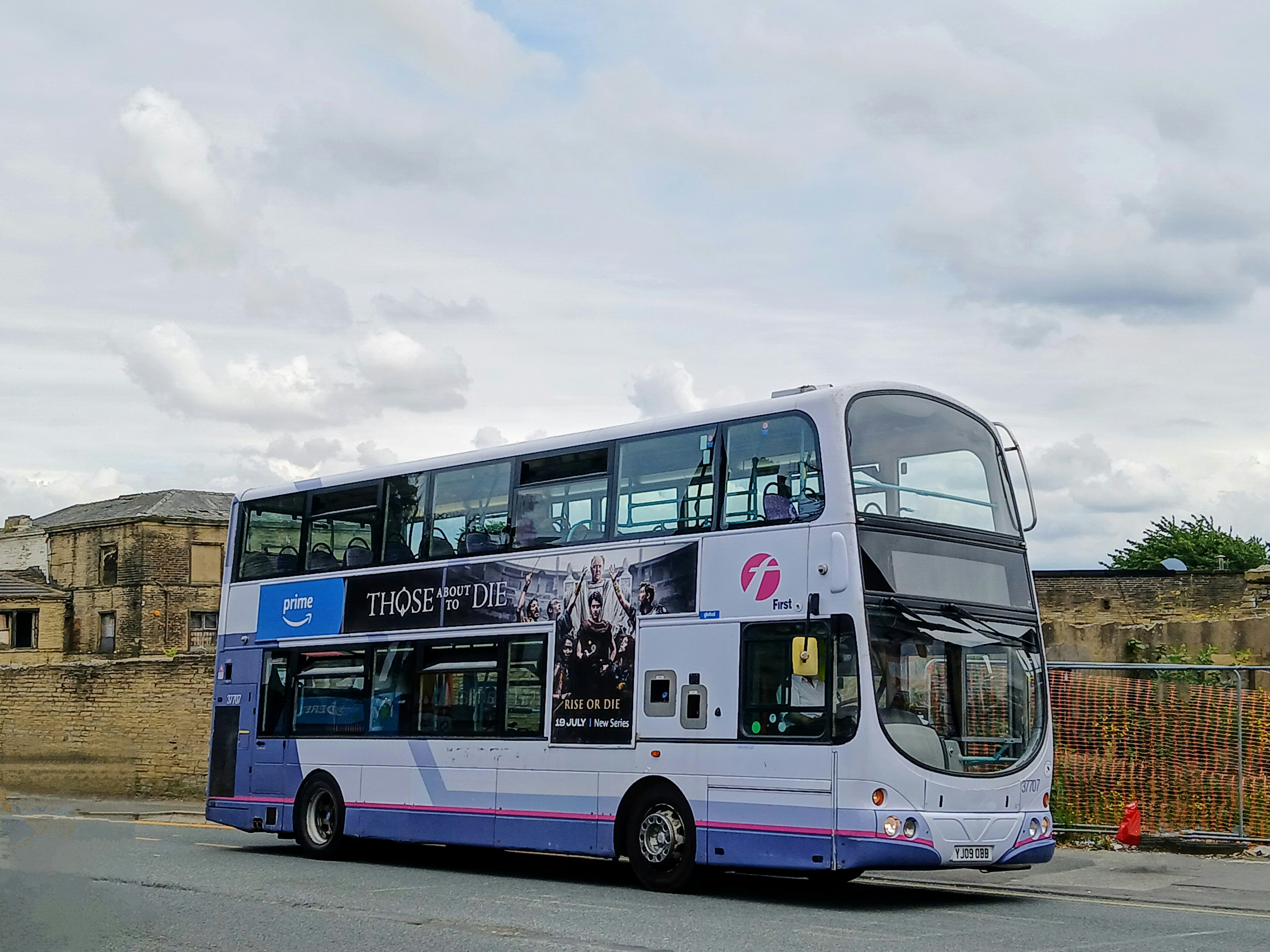 A double decker bus parked on the side of the road
