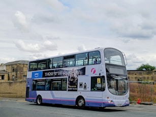 A double decker bus parked on the side of the road