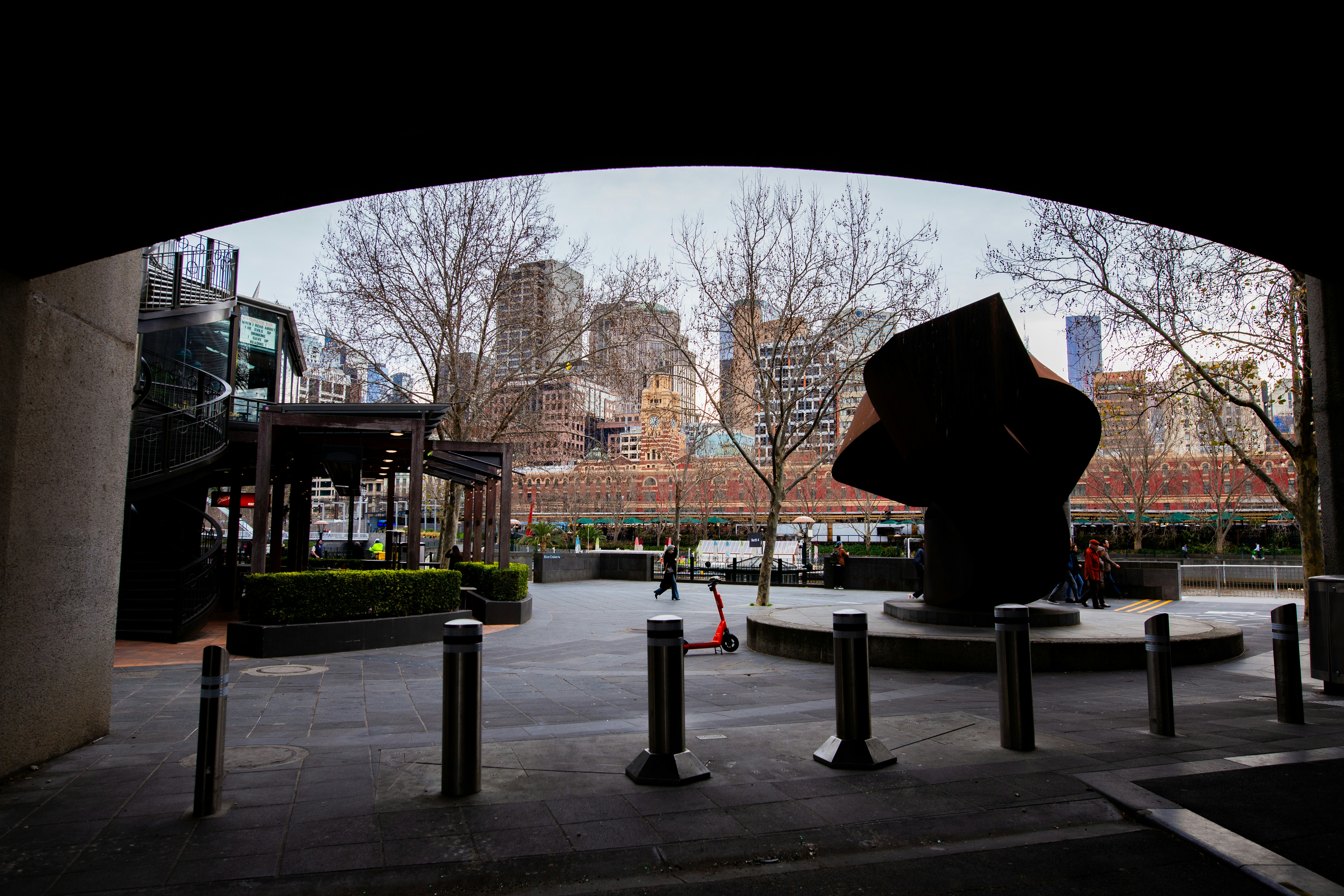 A view of a park through a tunnel