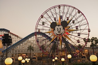 A ferris wheel with a mickey mouse face on it