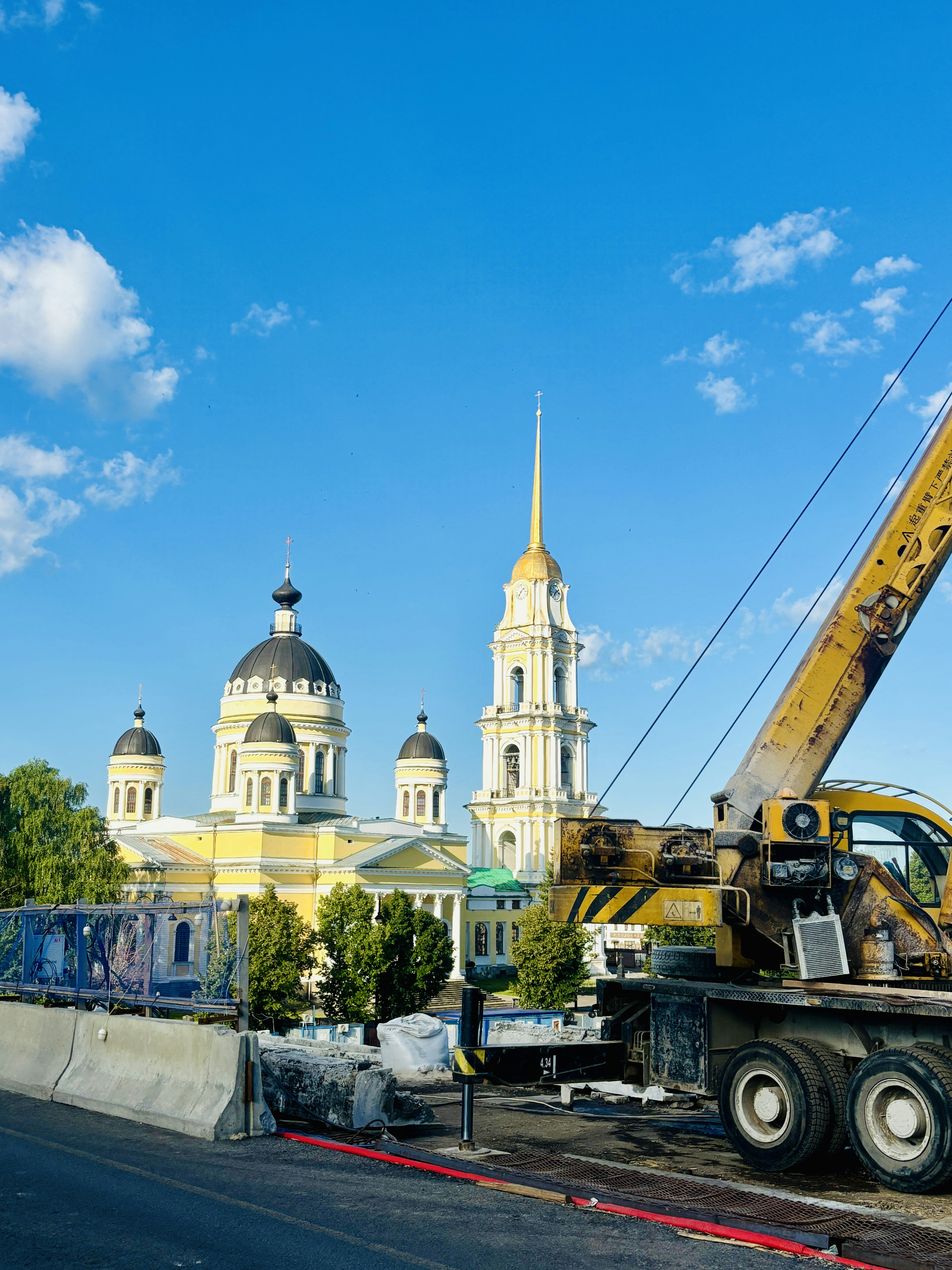 A large crane is on the side of the road