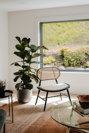 A living room filled with furniture and a large window