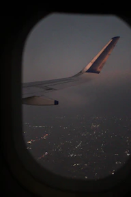 A view of the wing of an airplane in the sky