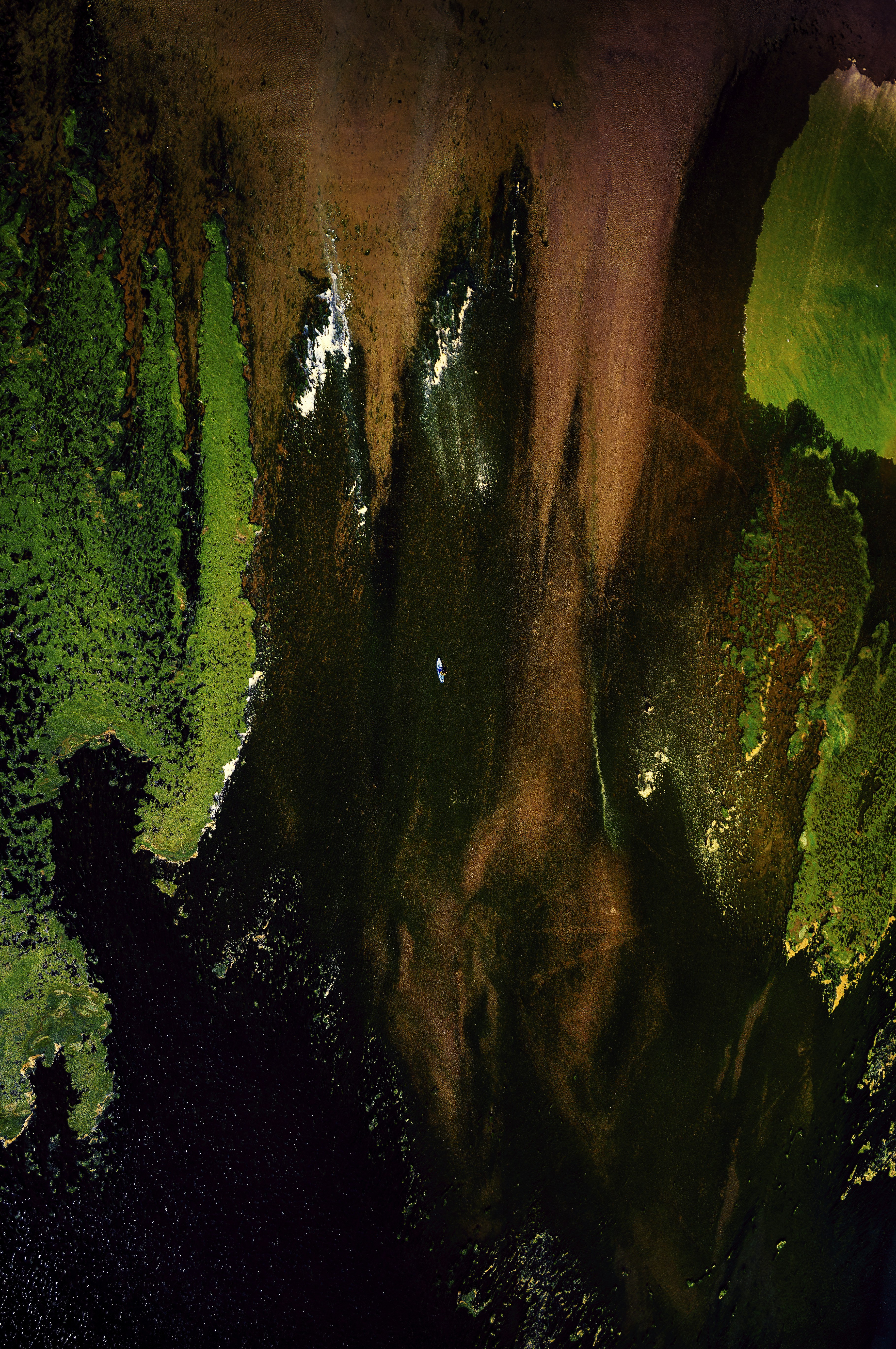 An abstract painting of green and brown colors