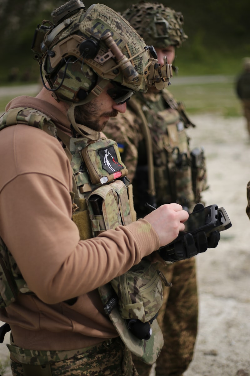 Soldiers in military combat gear in the field