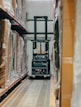 A warehouse filled with lots of boxes and pallets