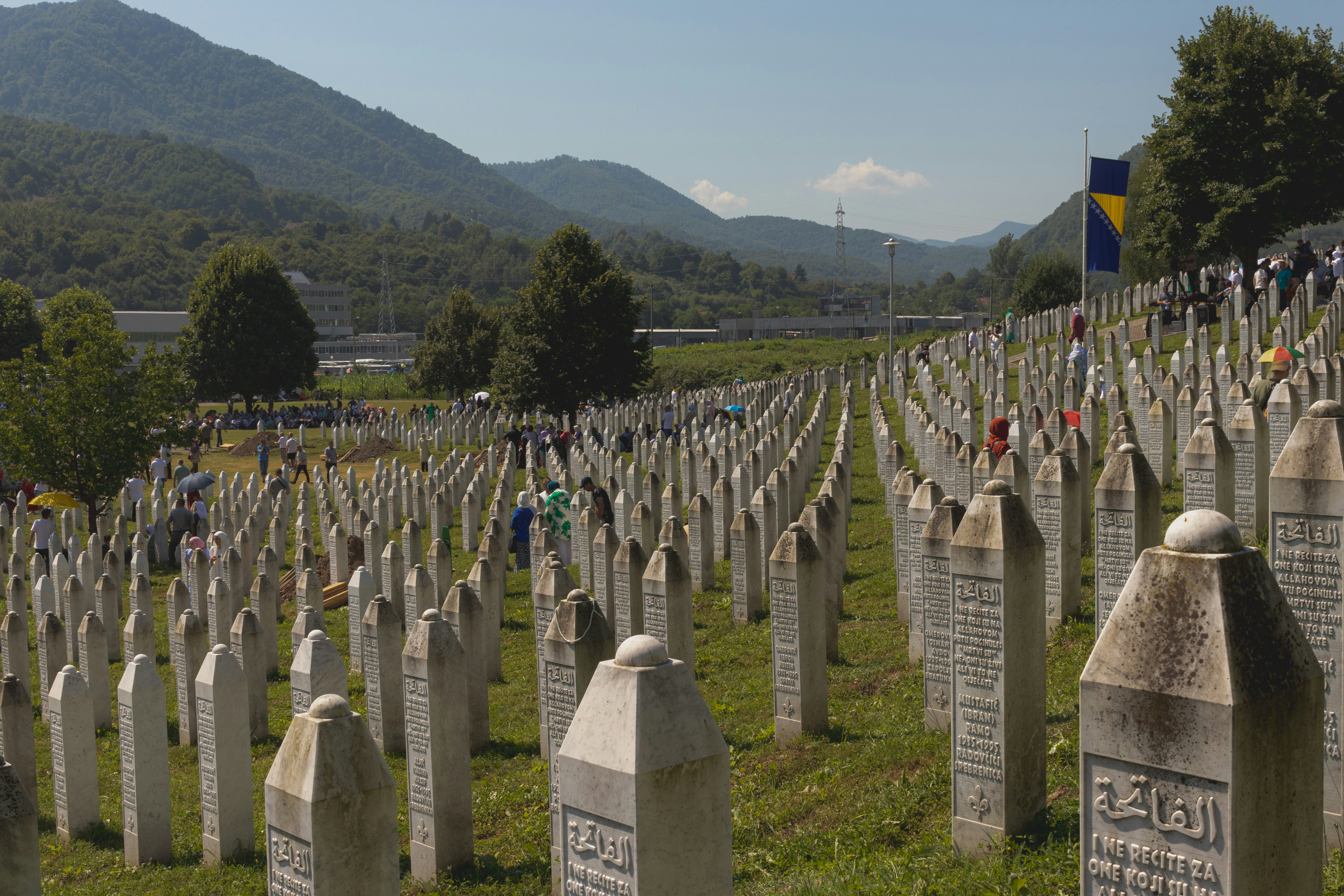 A large group of headstones in a cemetery