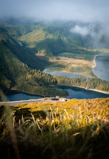 A scenic view of a body of water surrounded by mountains