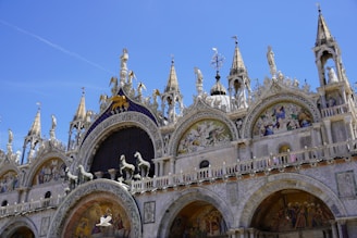 A large building with statues on the front of it