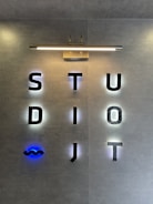 A sign that is on the side of a wall