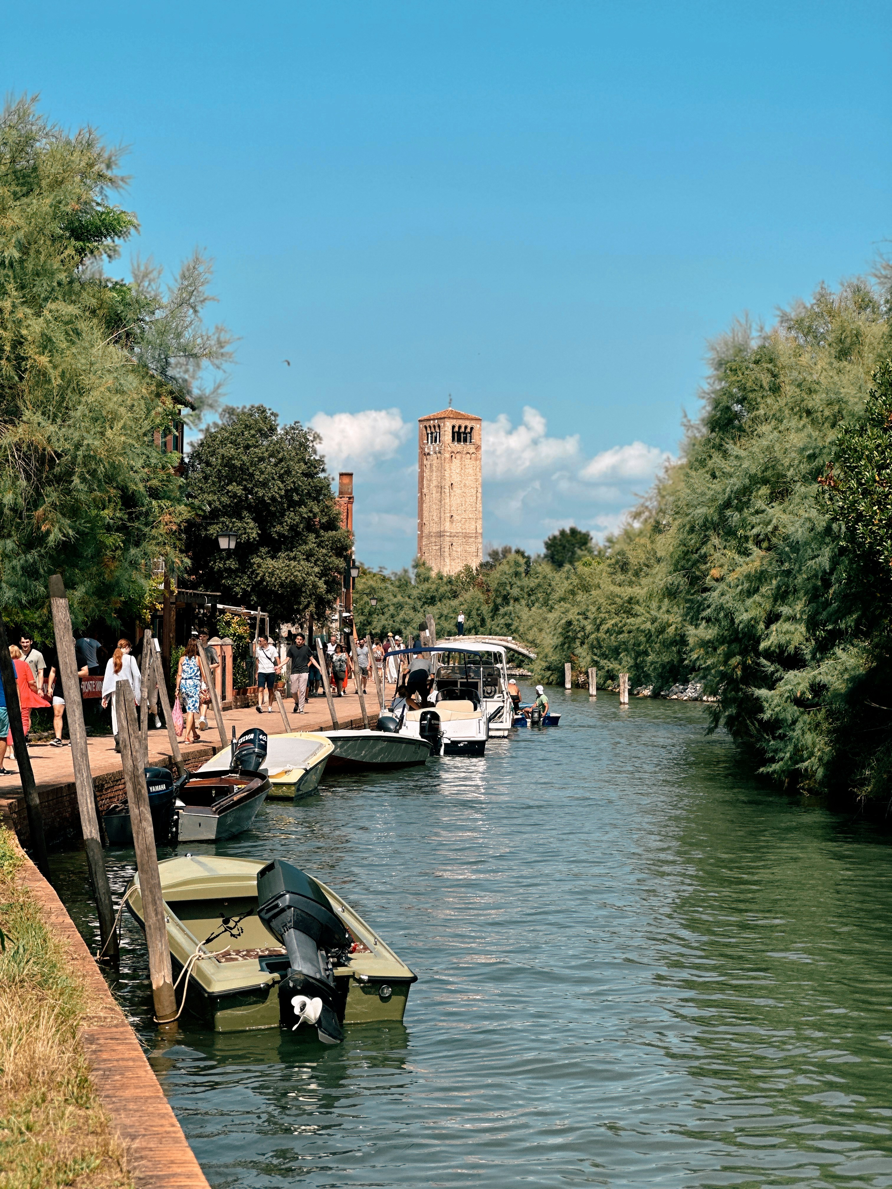 A group of boats that are sitting in the water