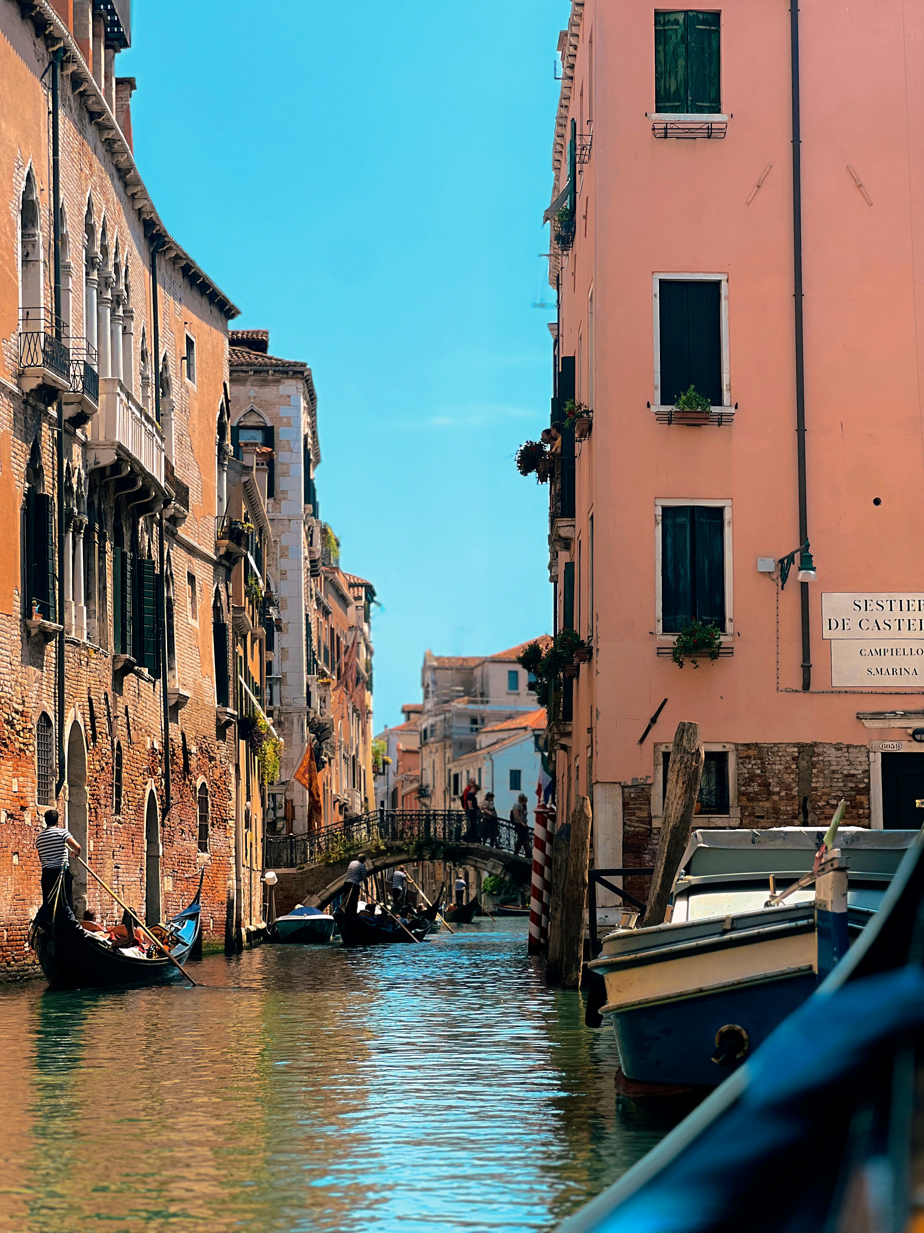 A narrow canal with boats and buildings on both sides