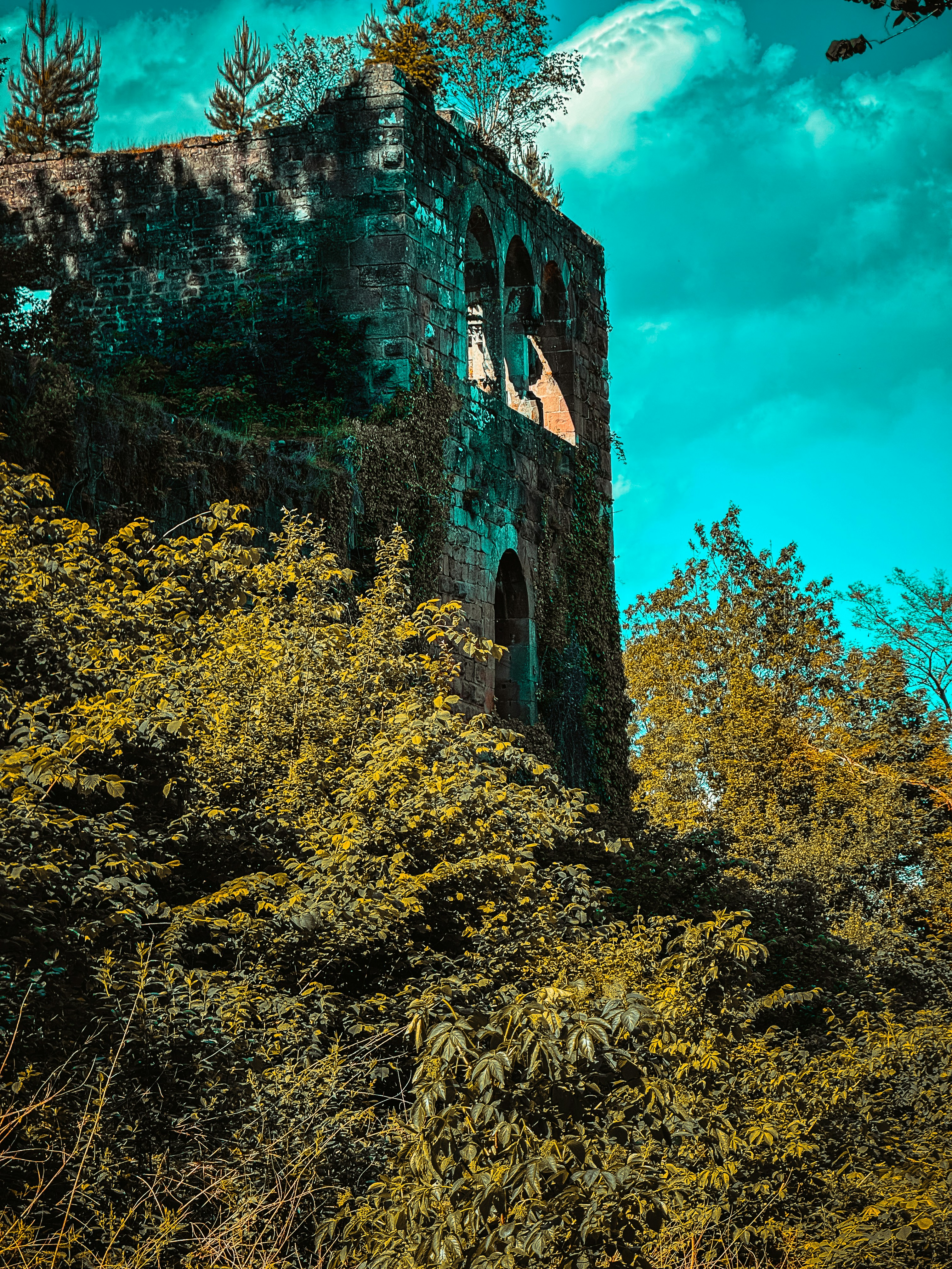 A tall tower with a clock on the side of it