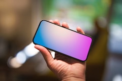 A person holding a phone in their hand