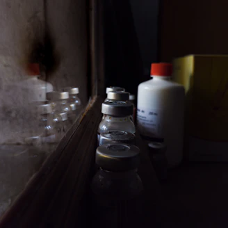 A bottle of liquid sitting on top of a counter