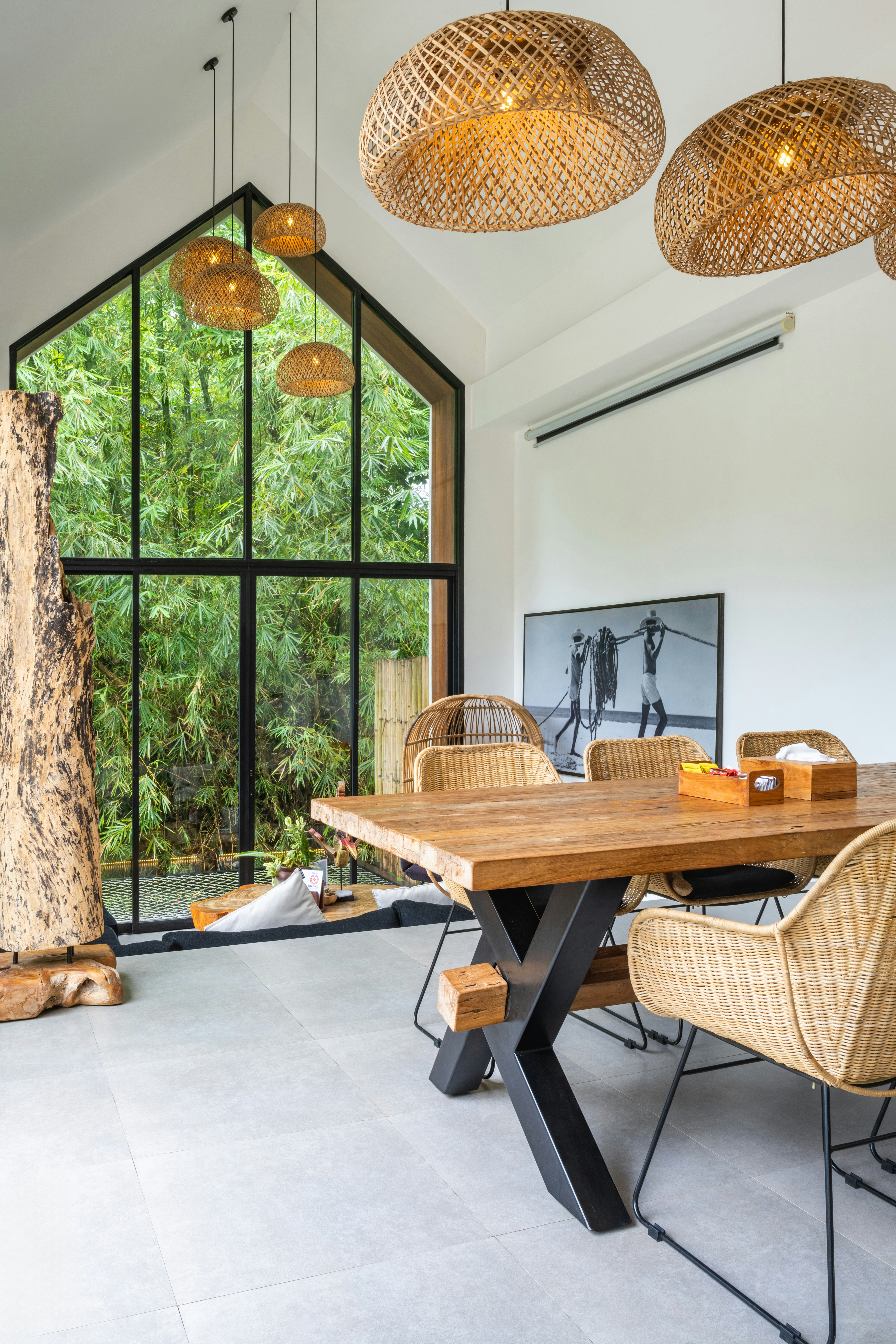 A dining room with a wooden table and chairs