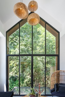 A living room filled with furniture and a large window
