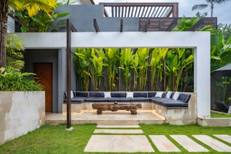 A patio with a couch and a table in it
