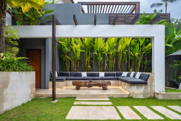 A patio with a couch and a table in it