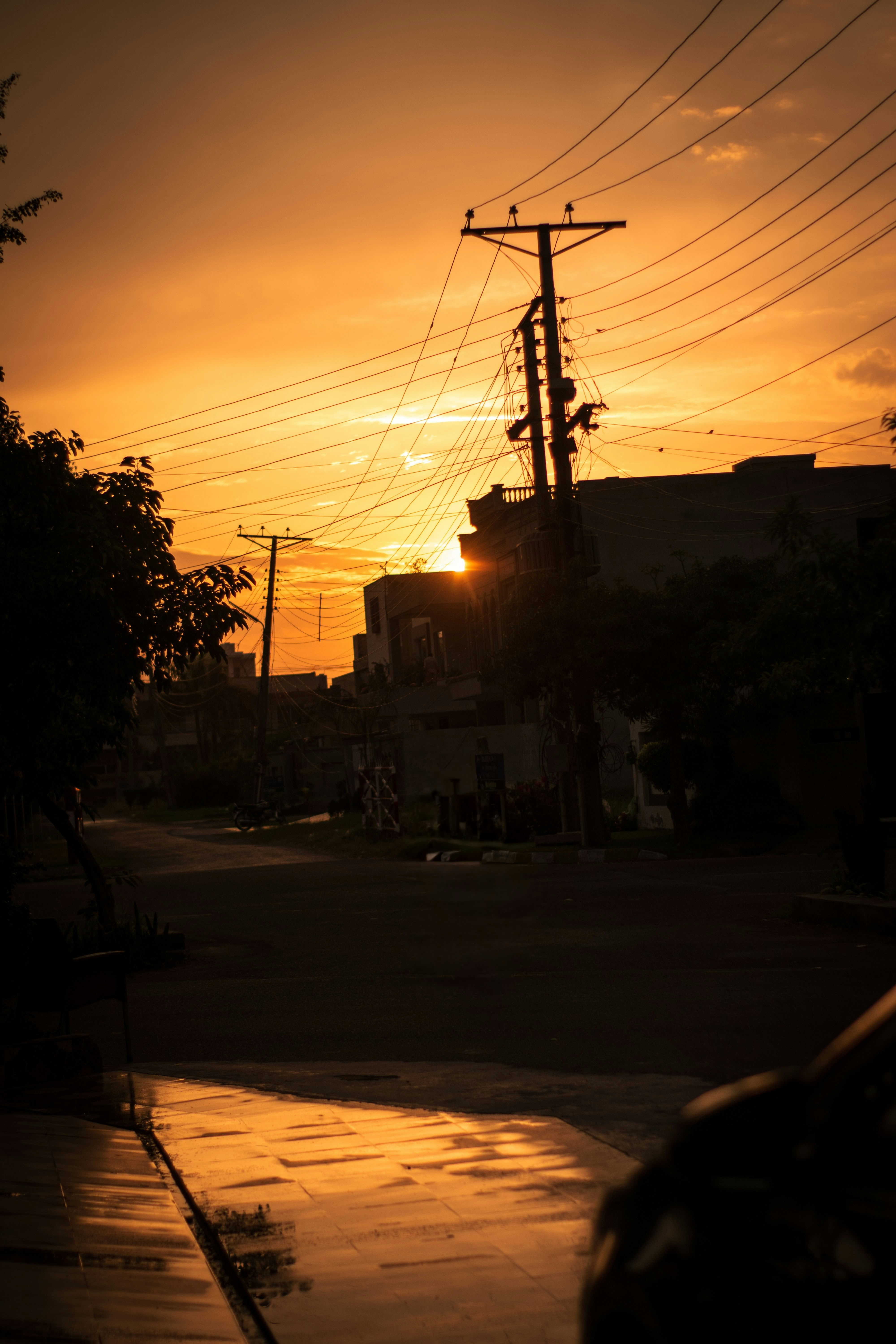The sun is setting over a city street