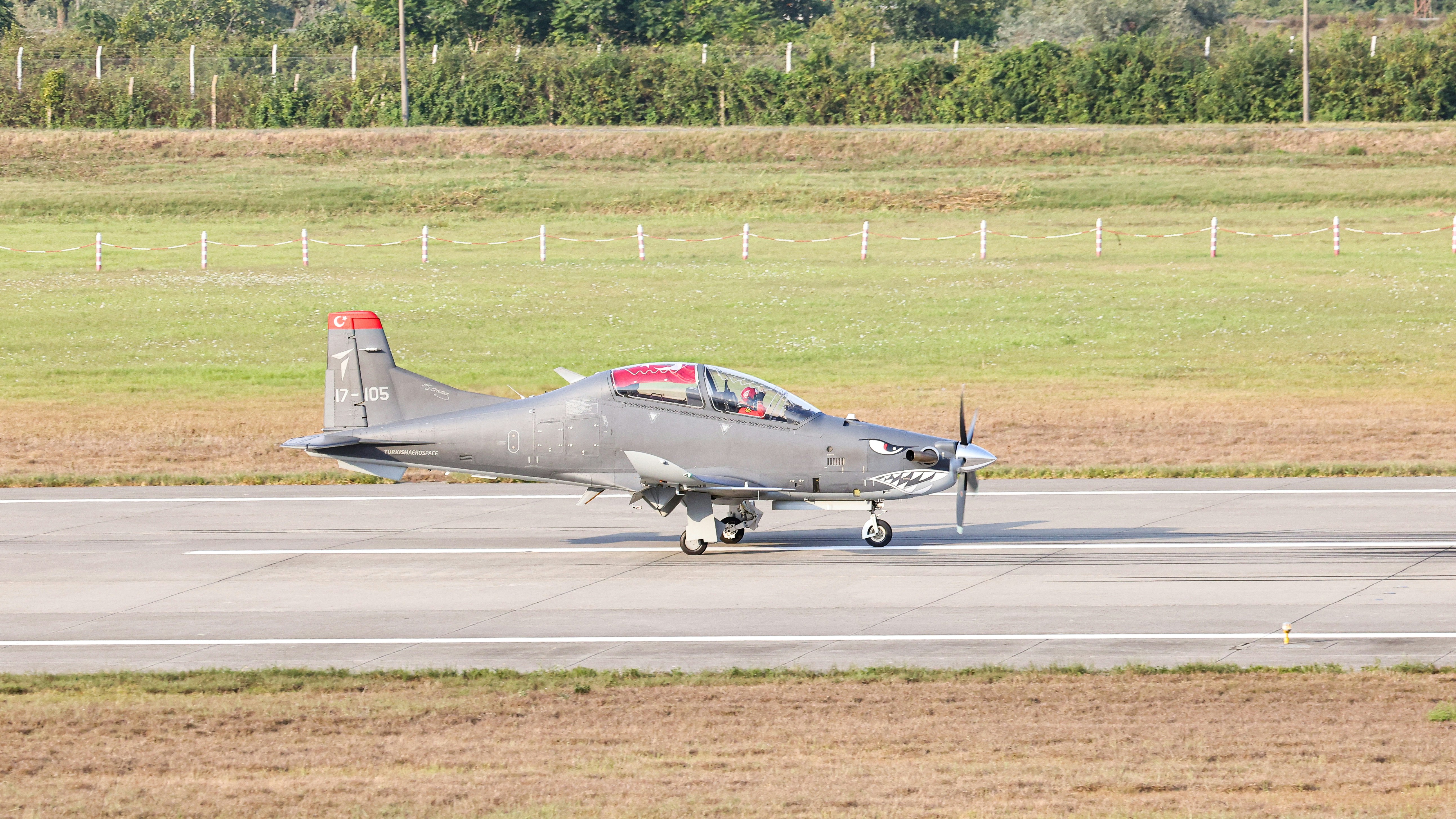 A fighter jet sitting on top of an airport runway