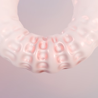 A close up of a plastic object on a white background