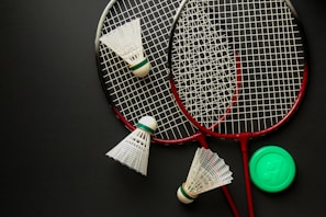 A couple of tennis rackets sitting on top of a table