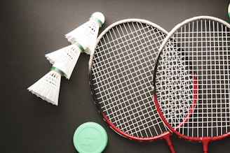 A couple of tennis racquets sitting on top of a table