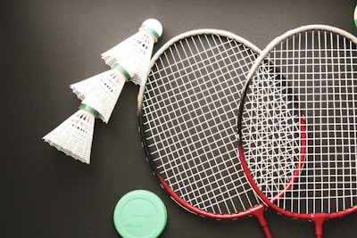 A couple of tennis racquets sitting on top of a table