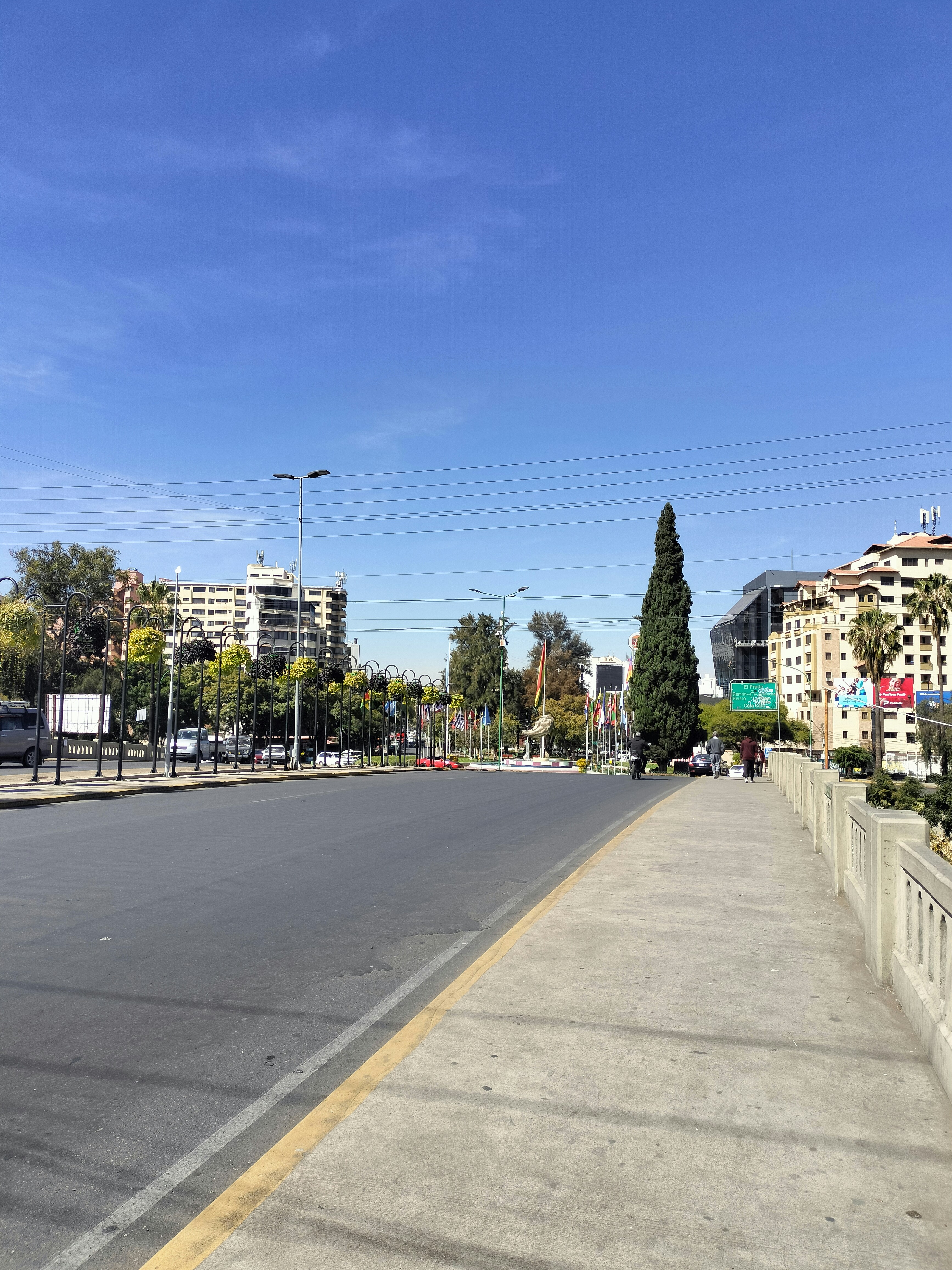An empty street with buildings in the background