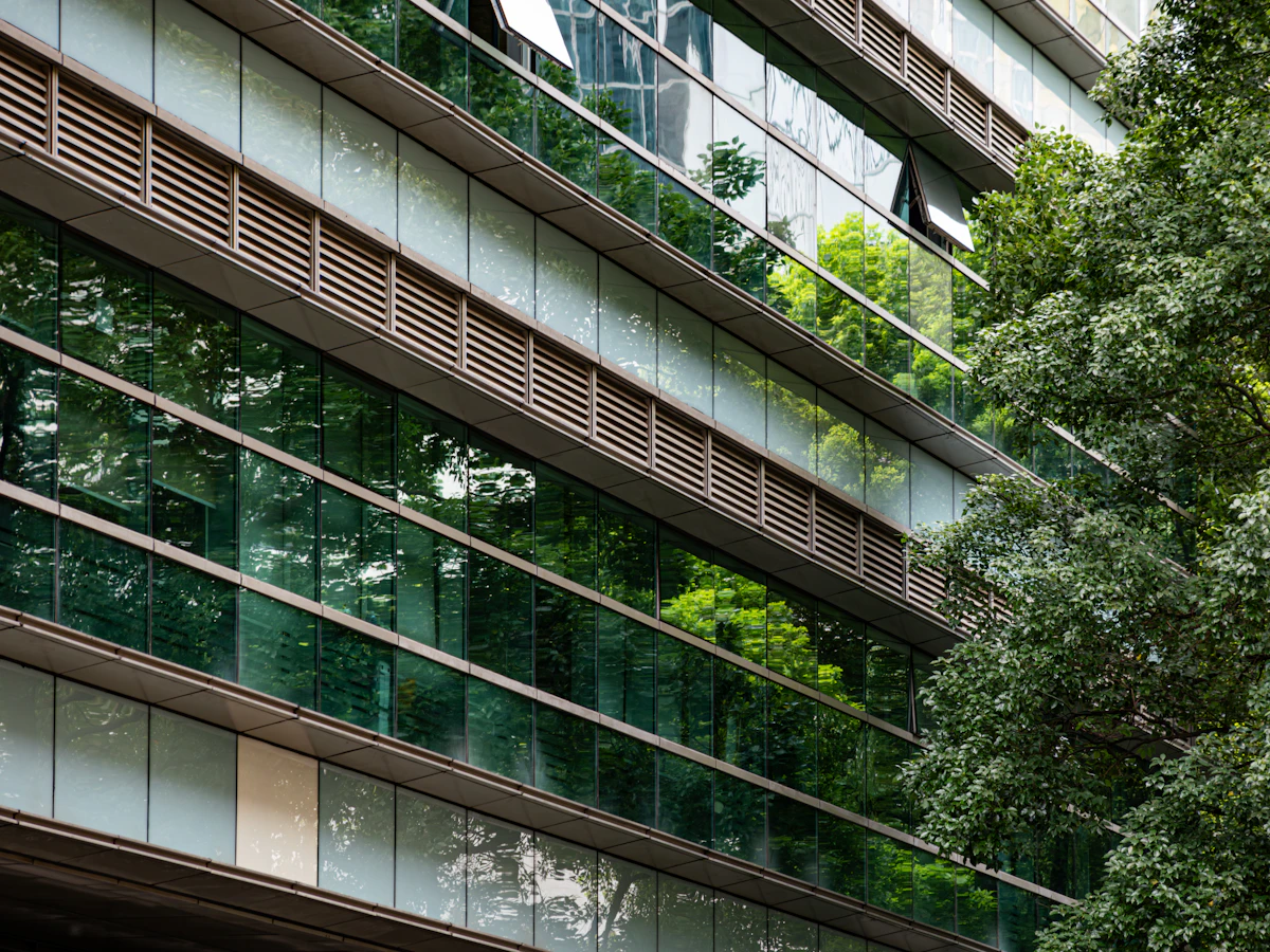 The glass facade of a corporate headquarters reflecting a $1 trillion future