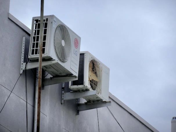 An air conditioner mounted to the side of a building