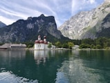 A body of water with mountains in the background