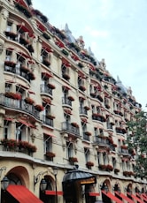 A very tall building with many balconies on it