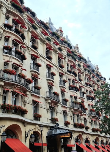 A very tall building with many balconies on it