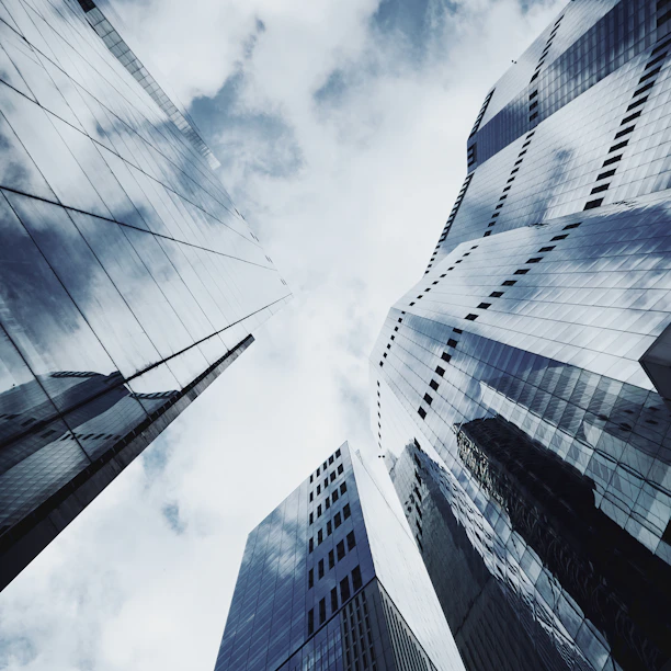 Looking up at tall buildings in a city
