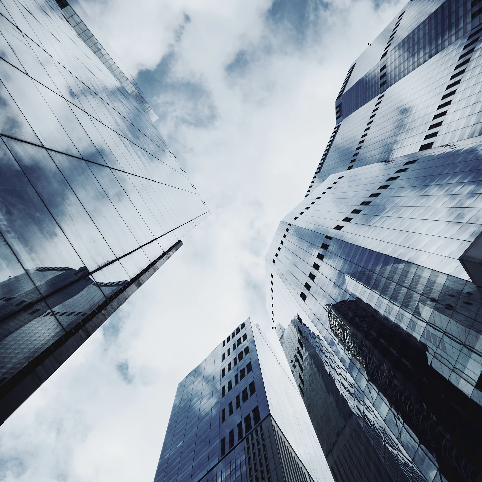 Looking up at tall buildings in a city