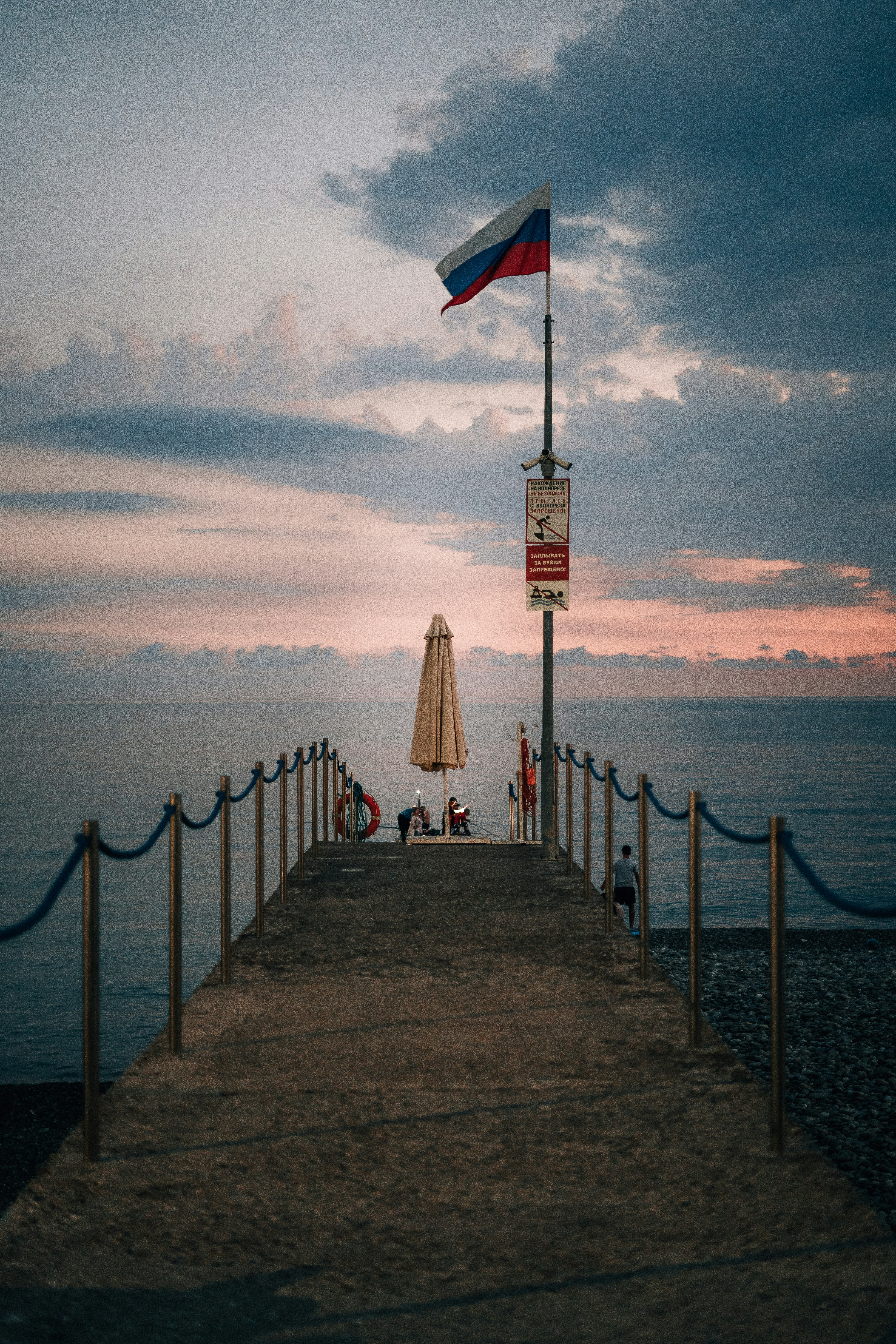A pier with a flag on top of it