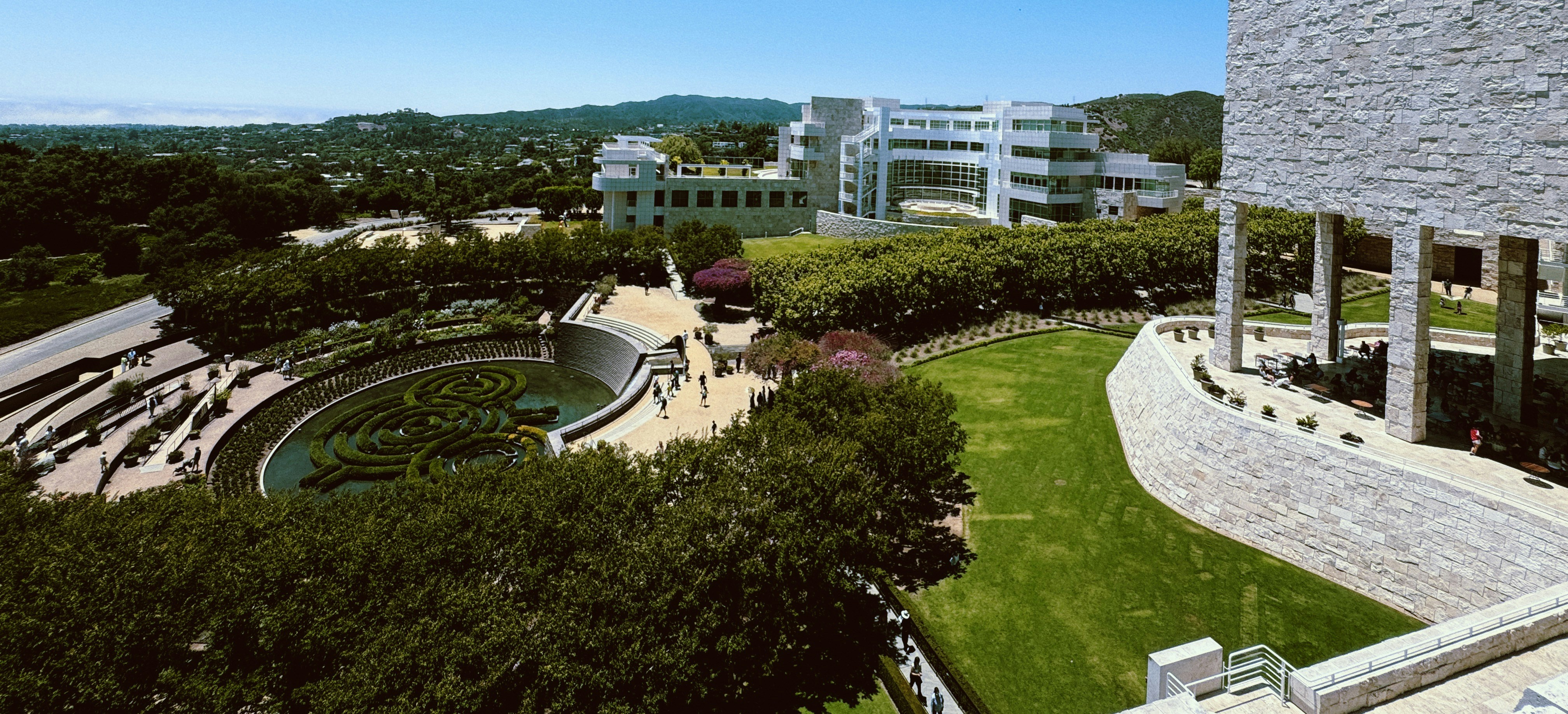 An aerial view of a building and a park