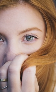 A close up of a person with red hair