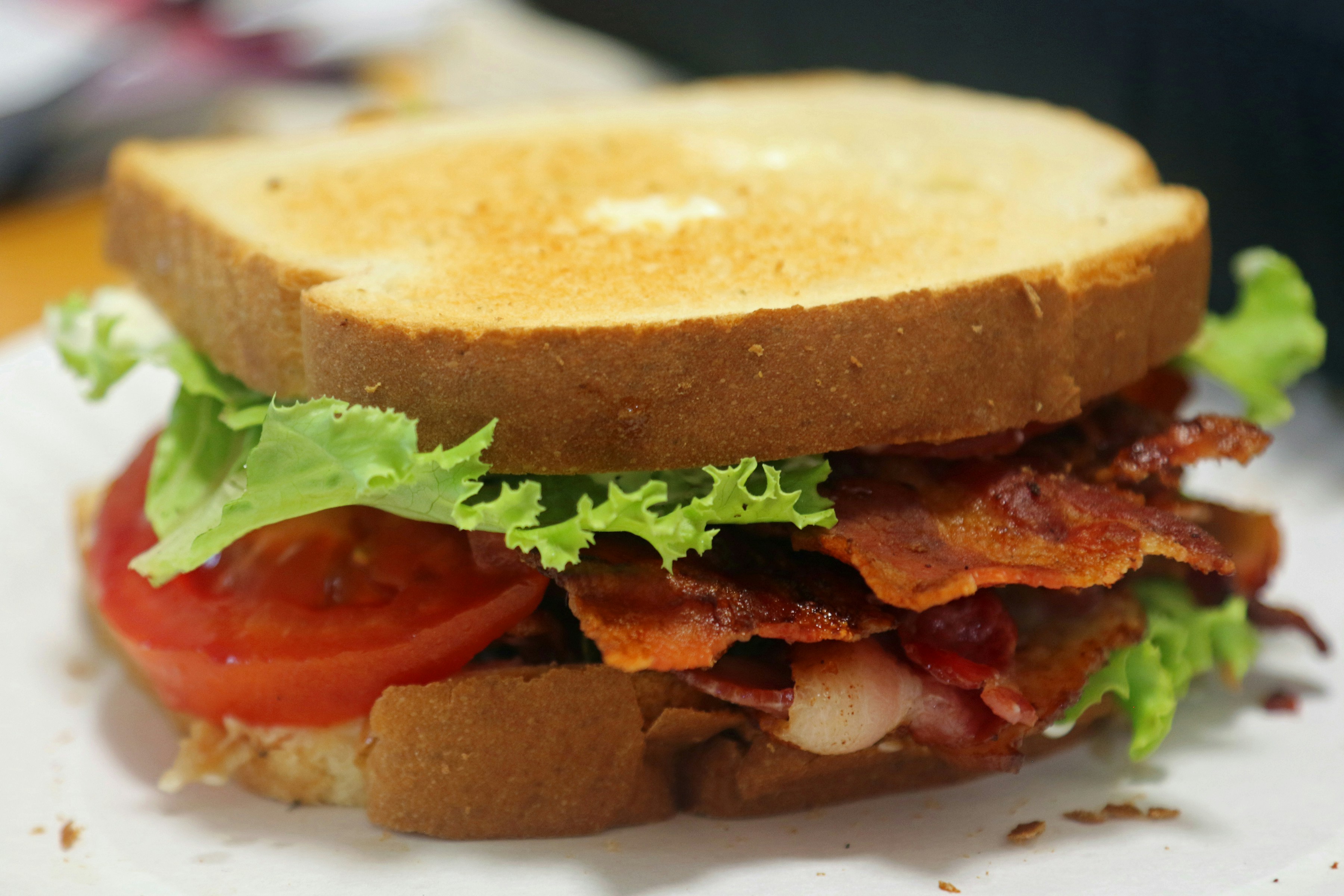 A bacon, tomato and lettuce sandwich on a plate