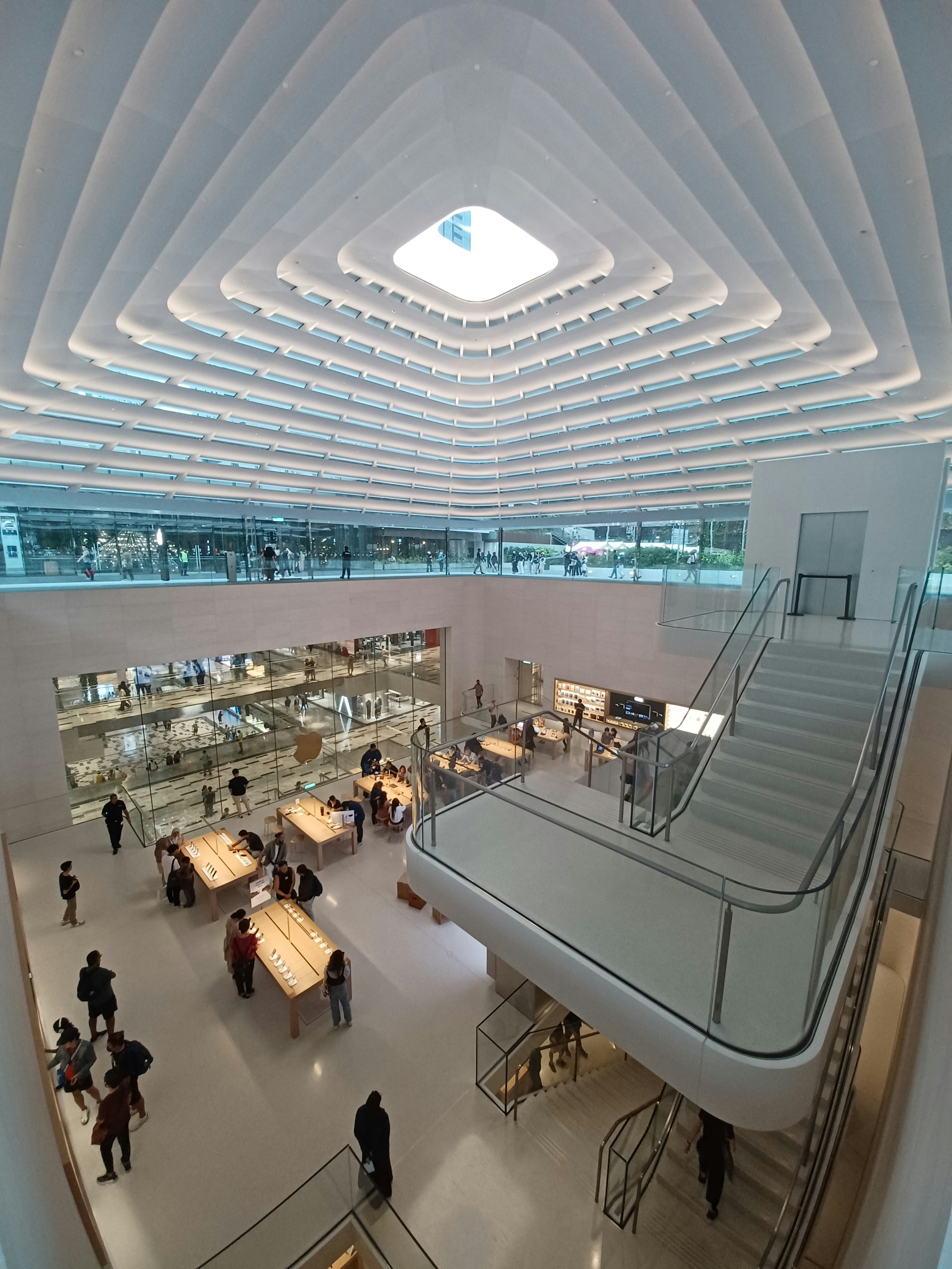 A very large building with a bunch of people inside of it