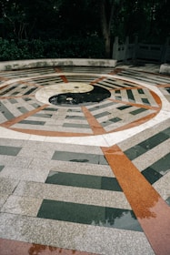 A circular area with a fire pit in the middle of it