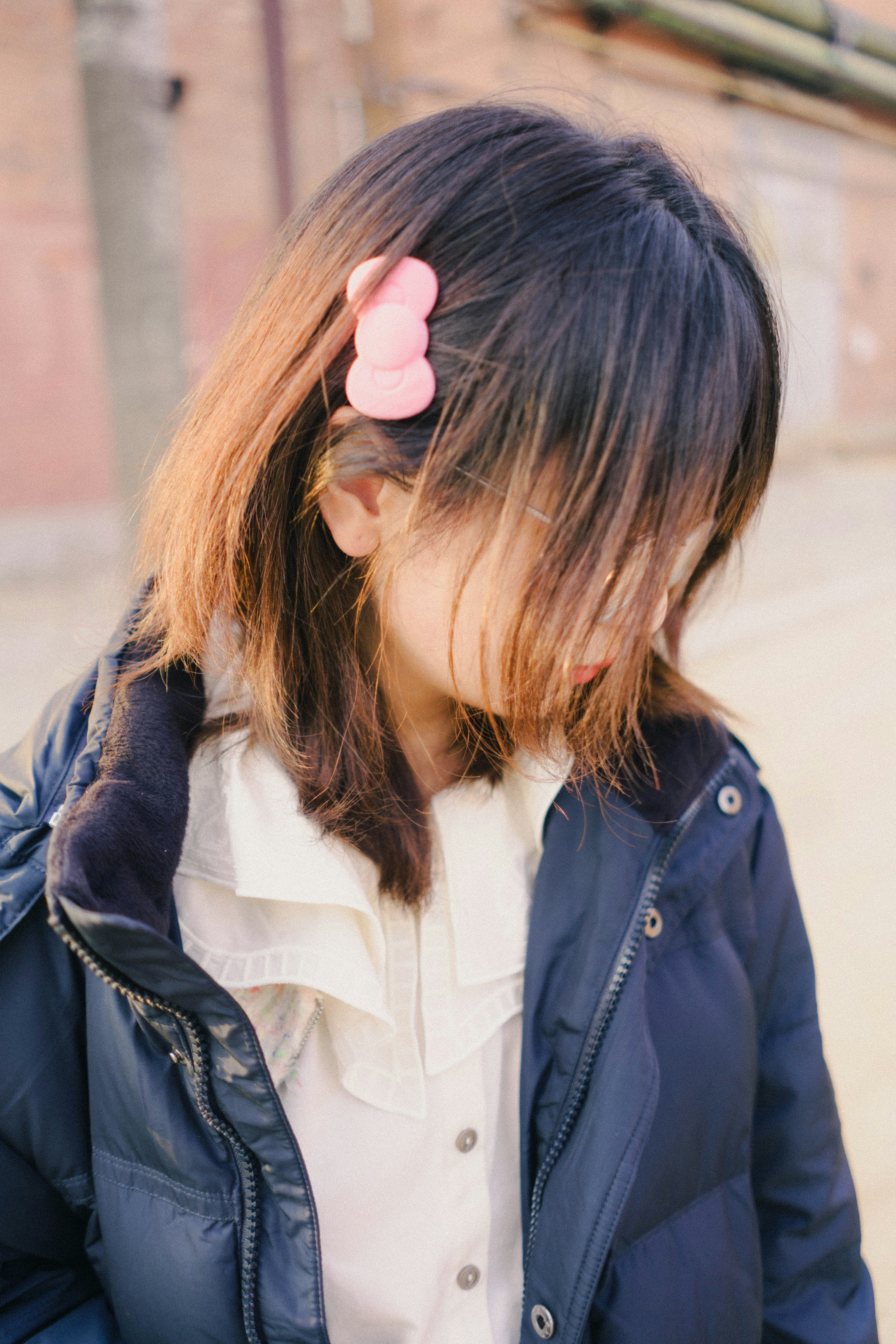 A little girl with a pink flower in her hair photo – Free Portrait ...
