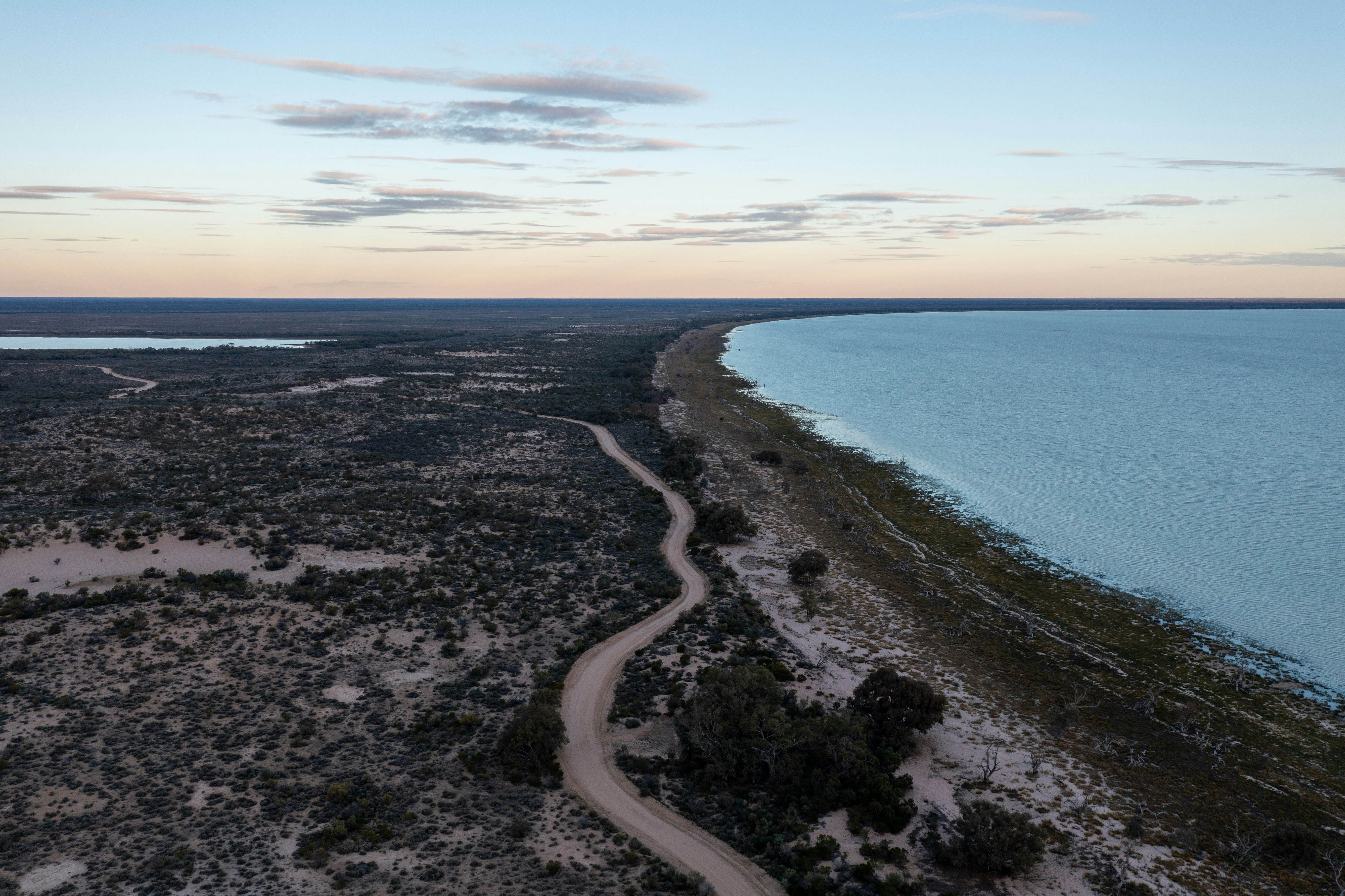 An aerial view of a beach and a body of water