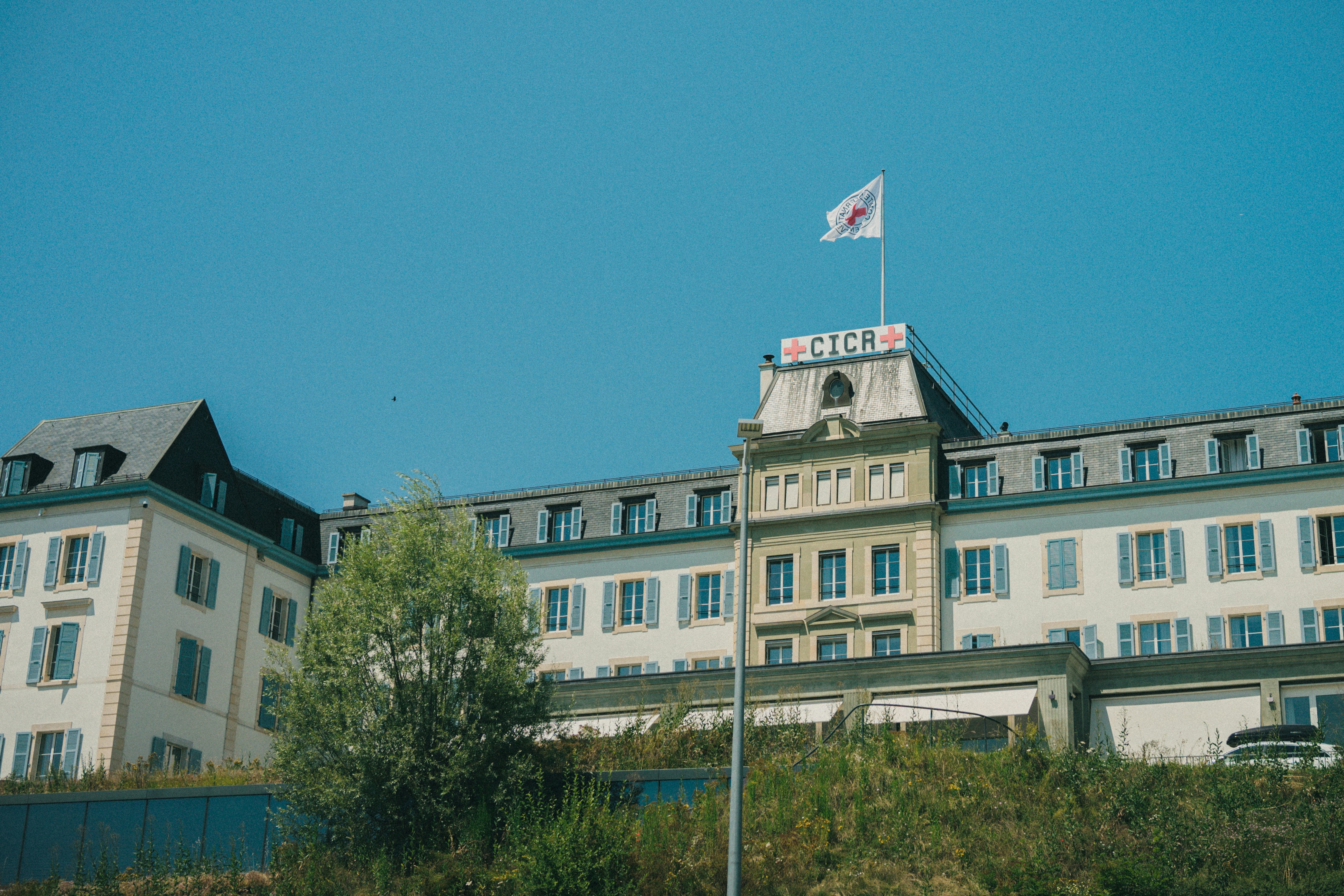 A tall building with a flag on top of it