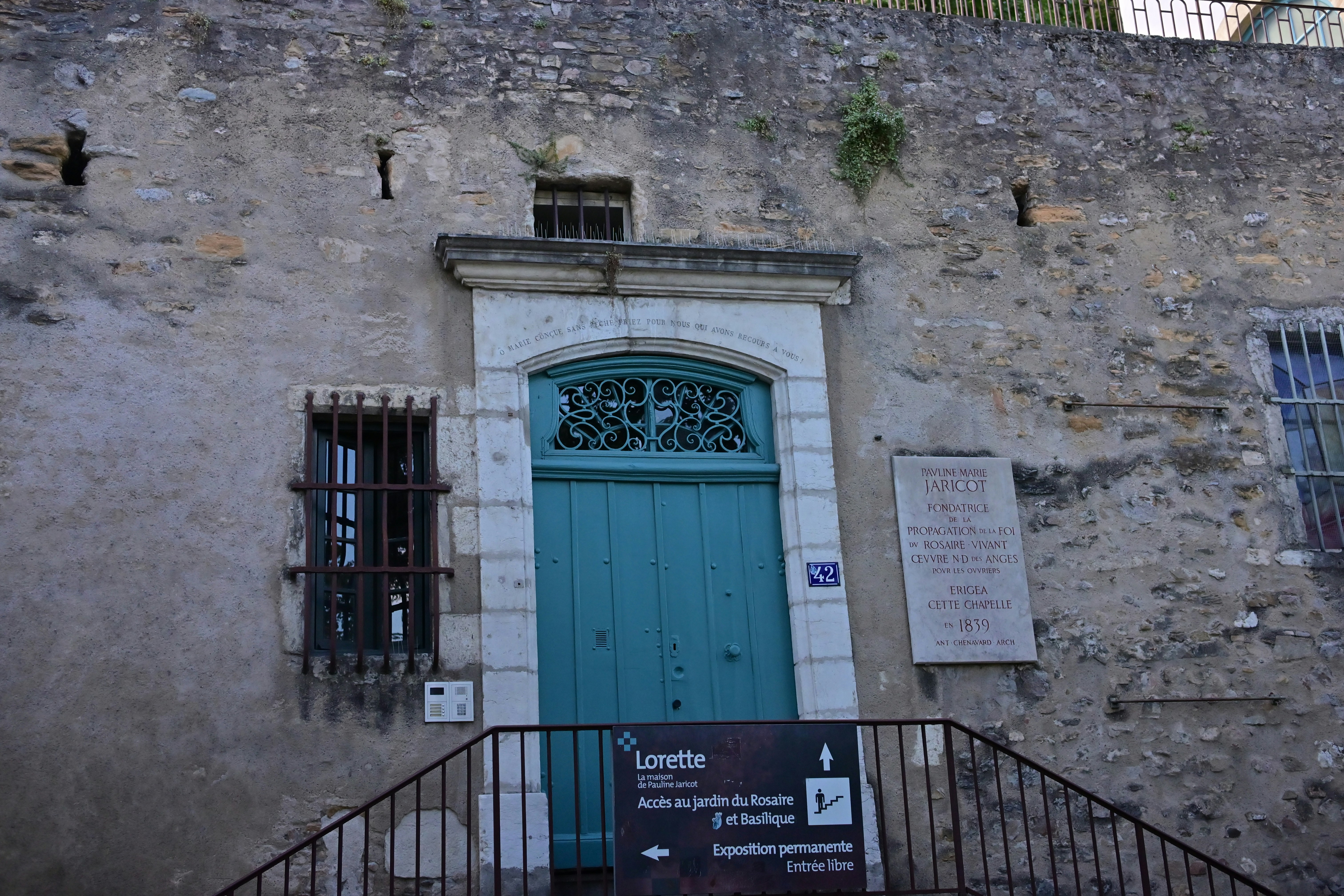 An old building with a blue door and window