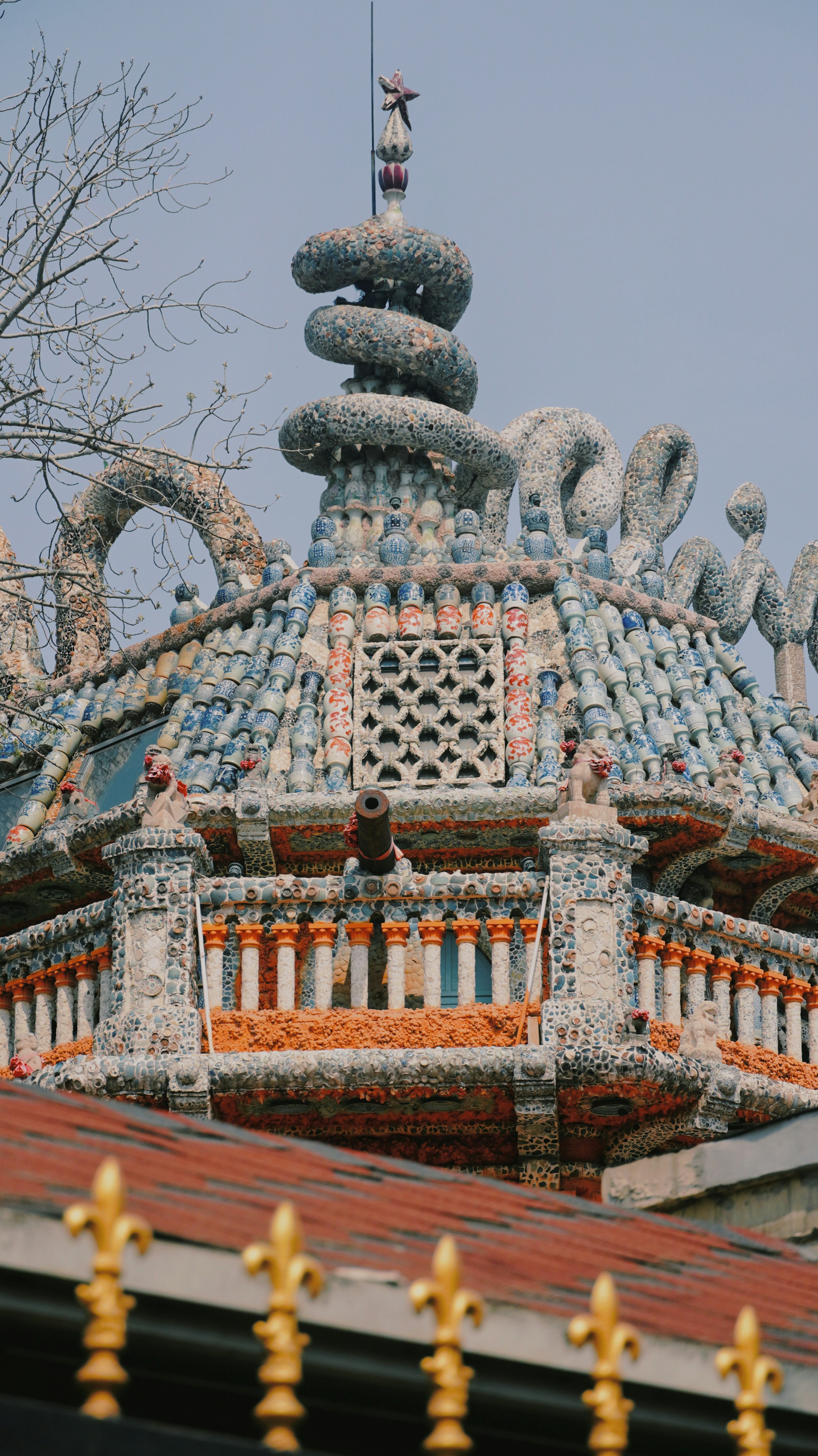 The roof of a building with a dragon decoration on it